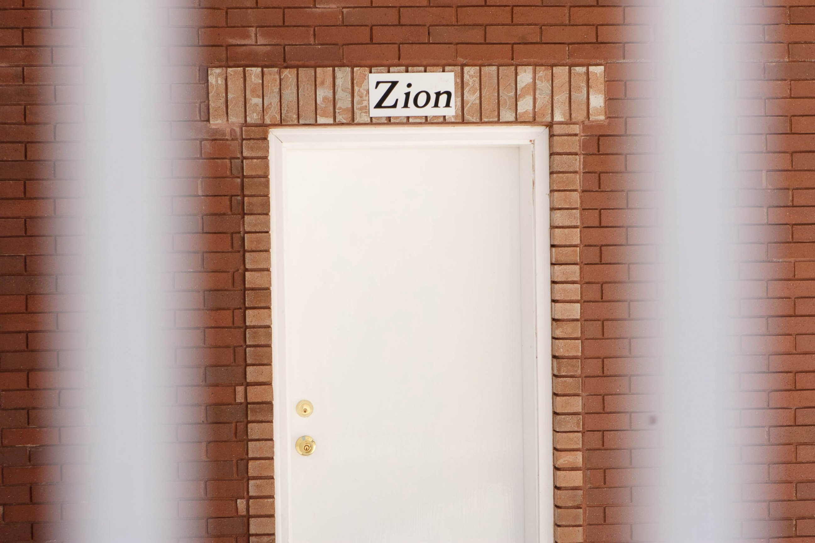 PHOTO: In this April 26, 2013 photo, a sign reads, "Zion", over the door of a home intended for the family of Warren Jeffs in Hildale, Utah.