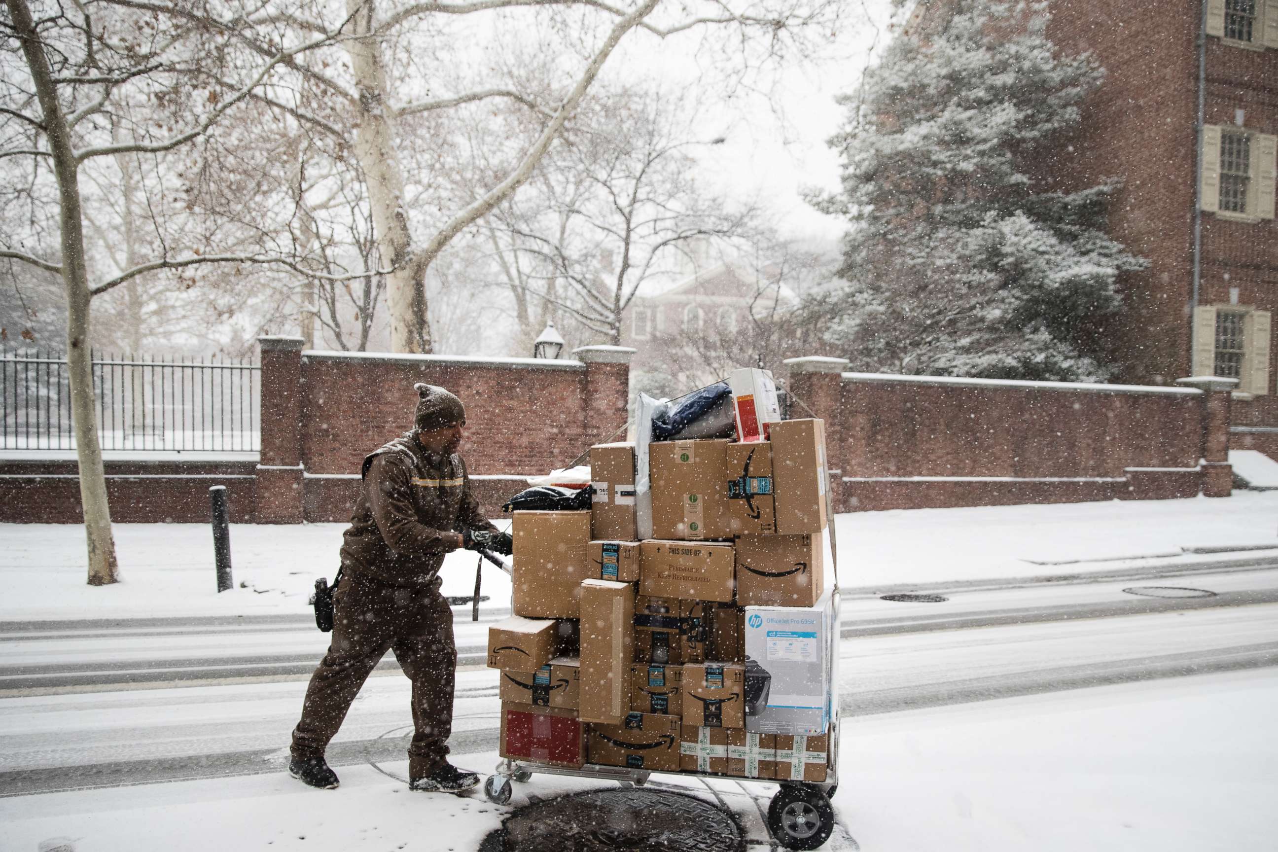 PHOTO: A United Parcel Service worker makes his deliveries during a snowstorm in Philadelphia, Friday, Dec. 15, 2017.