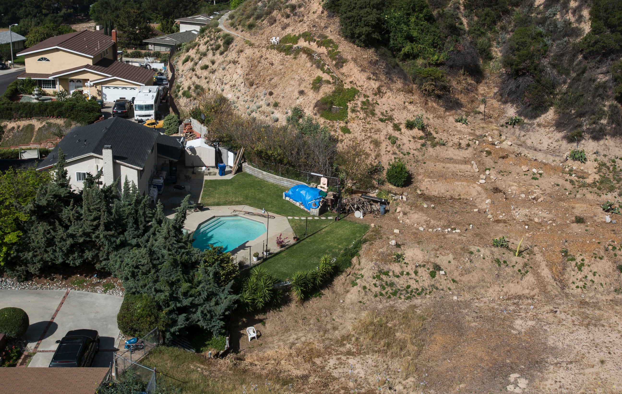 PHOTO: A home with a swimming pool sits near hillside, April 2, 2015, in Altadena, Calif. 