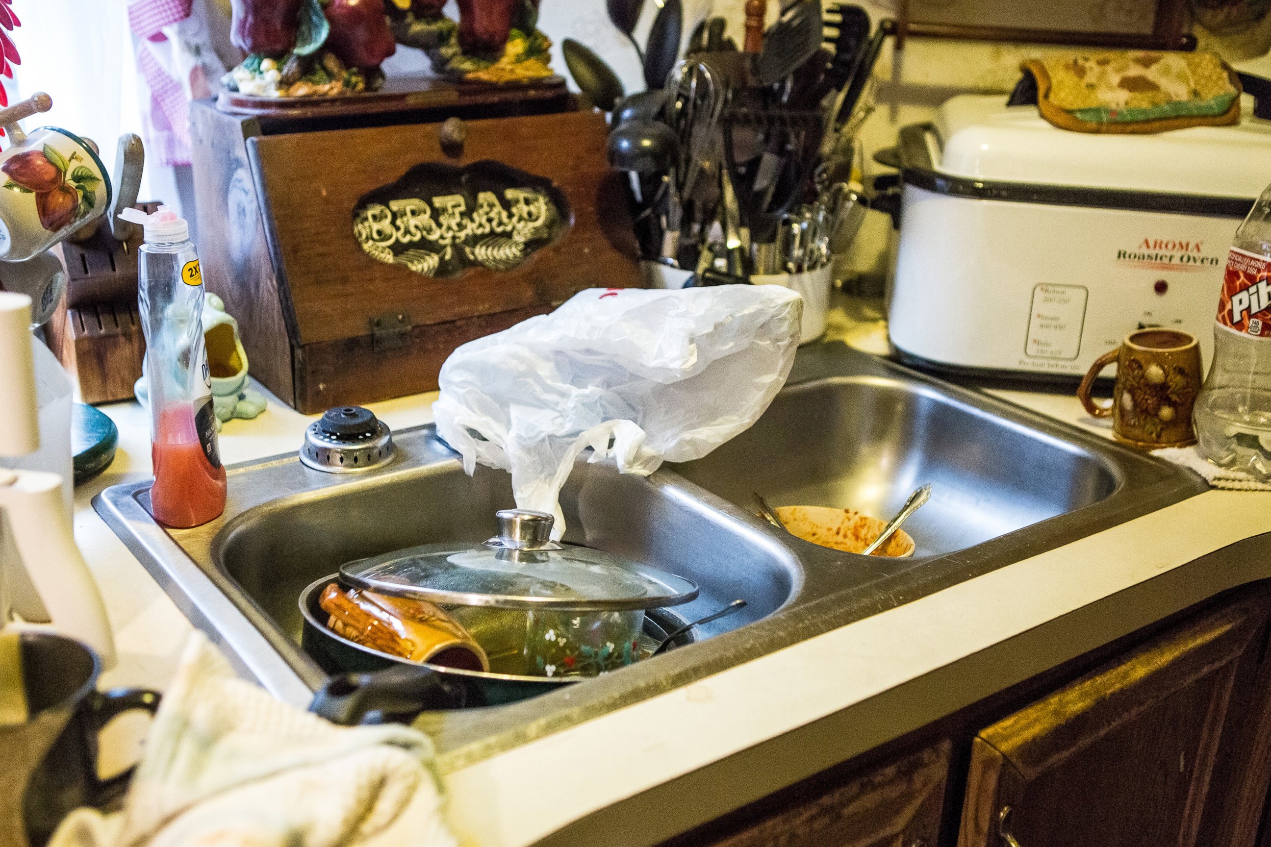PHOTO: Bonnie Wireman of Dry Branch, W.Va has covered her kitchen faucets in a bag because she kept forgetting about the ban on using tap water for drinking and washing.