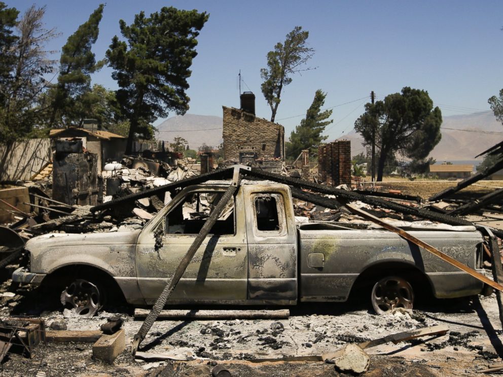 PHOTO: A pickup truck destroyed by a wildfire sits on a burned property, June 24, 2016, near Lake Isabella, Calif.