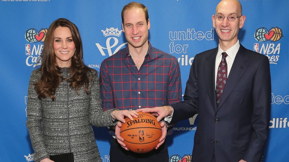 PHOTO: Prince William, the Duke of Cambridge, and Catherine, Duchess of Cambridge, pose for a photo with NBA Commissioner Adam Silver while attending a basketball game, Dec. 8, 2014 in New York.  