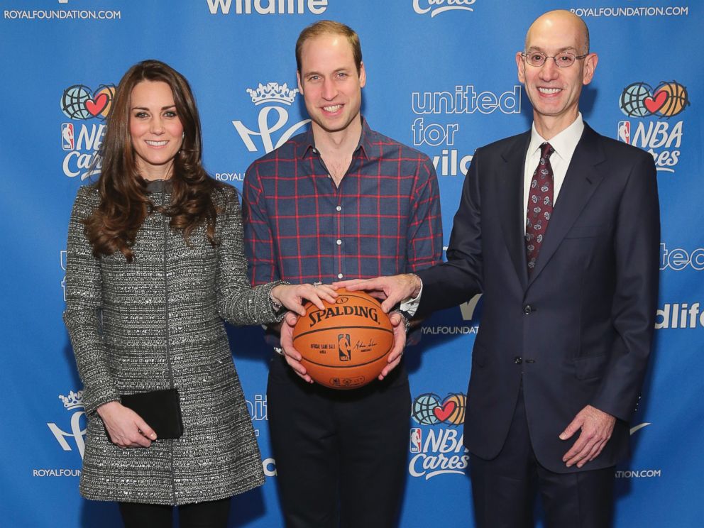 PHOTO: Prince William, the Duke of Cambridge, and Catherine, Duchess of Cambridge, pose for a photo with NBA Commissioner Adam Silver while attending a basketball game, Dec. 8, 2014 in New York.  