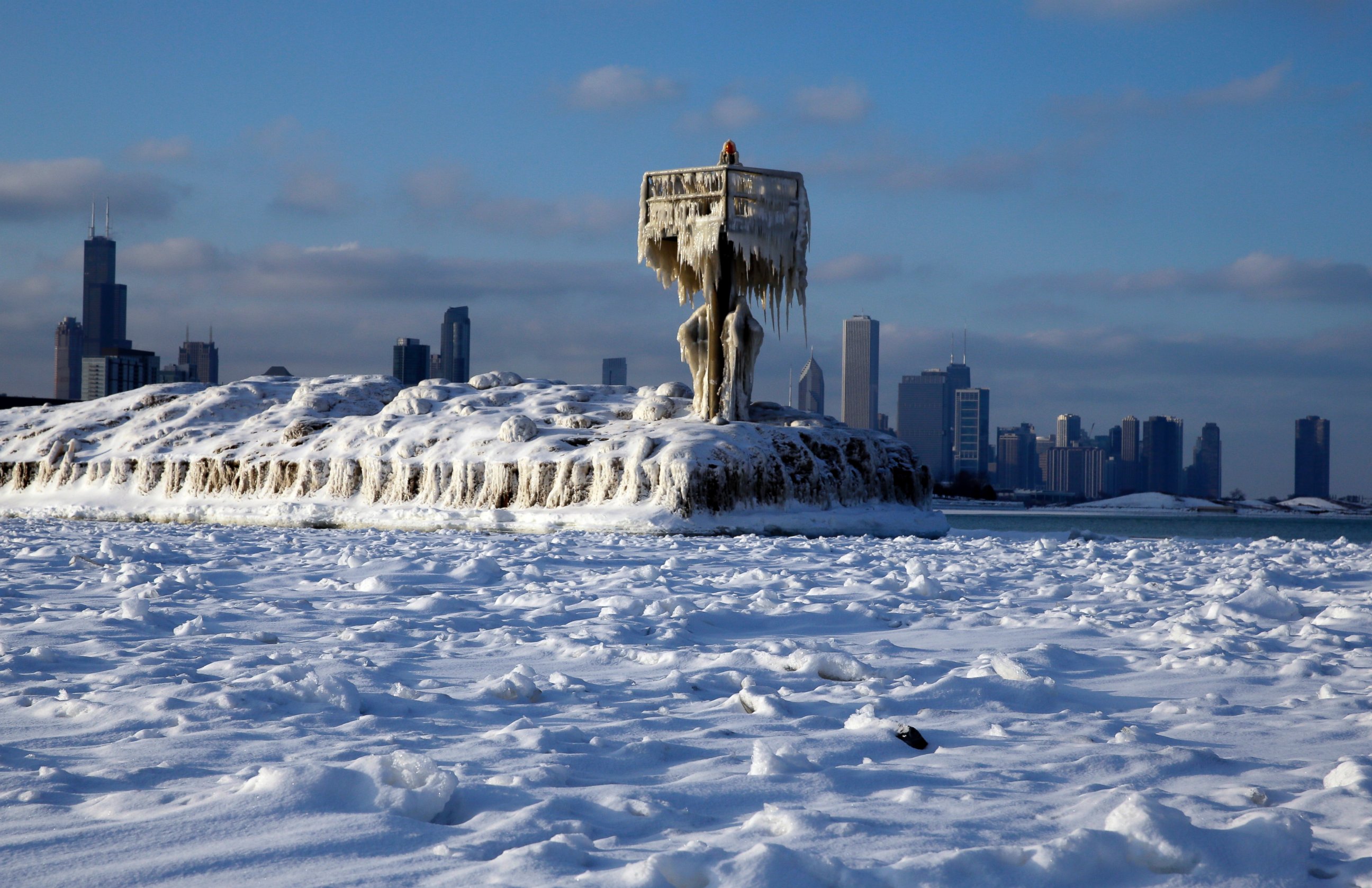 PHOTO: A harbor light is covered by snow and ice on the Lake Michigan at 31st Street Harbor, Sunday, March 1, 2015, in Chicago.