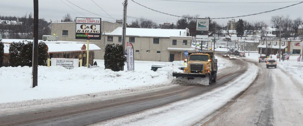 PHOTO: A driver of a PennDOT plow truck clears snow off of South Church Street, in Hazleton Pa., Jan. 26, 2015. 