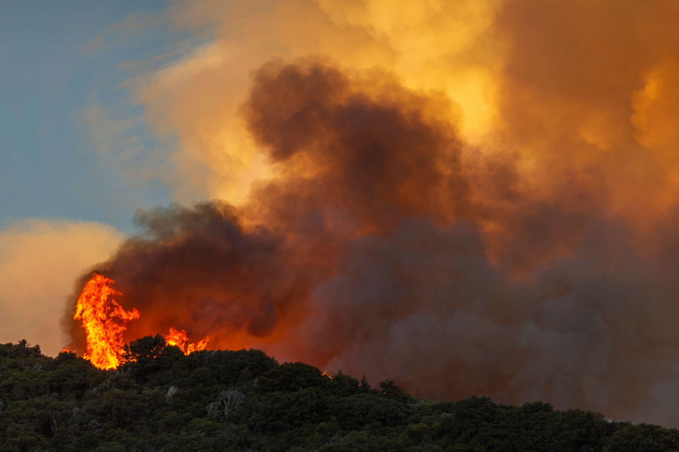 PHOTO: Flames and heavy smoke approach on a western front of the Apple Fire, Aug. 1, 2020,in Cherry Valley, California.