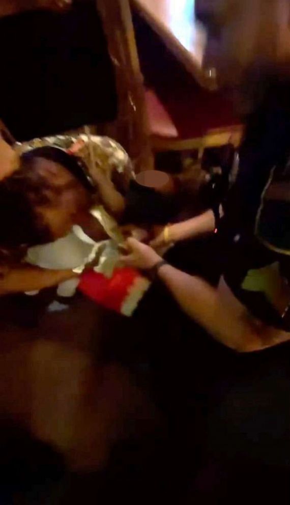 PHOTO: In this screen grab from bodycam video, a man is arrested while holding a baby in an Applebee's in Kenosha, Wis., on July 20, 2023.