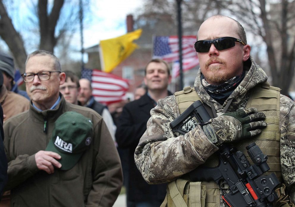 PHOTO: Brock Peterson covers his heart while holding his custom AR-15 rifle during a pro-Second Amendment rally held in front of the Wyoming Supreme Court in Cheyenne, Wyo., April 14, 2018. 