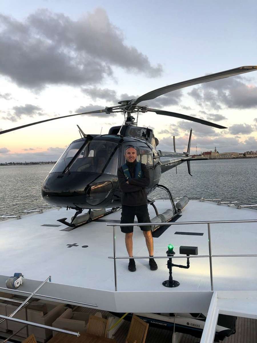 PHOTO: A photo released by Group 3 Aviation shows pilot Ara Zobayan standing in front of a helicopter. "Flying was his life's passion," the aviation company that trained him wrote on Facebook.