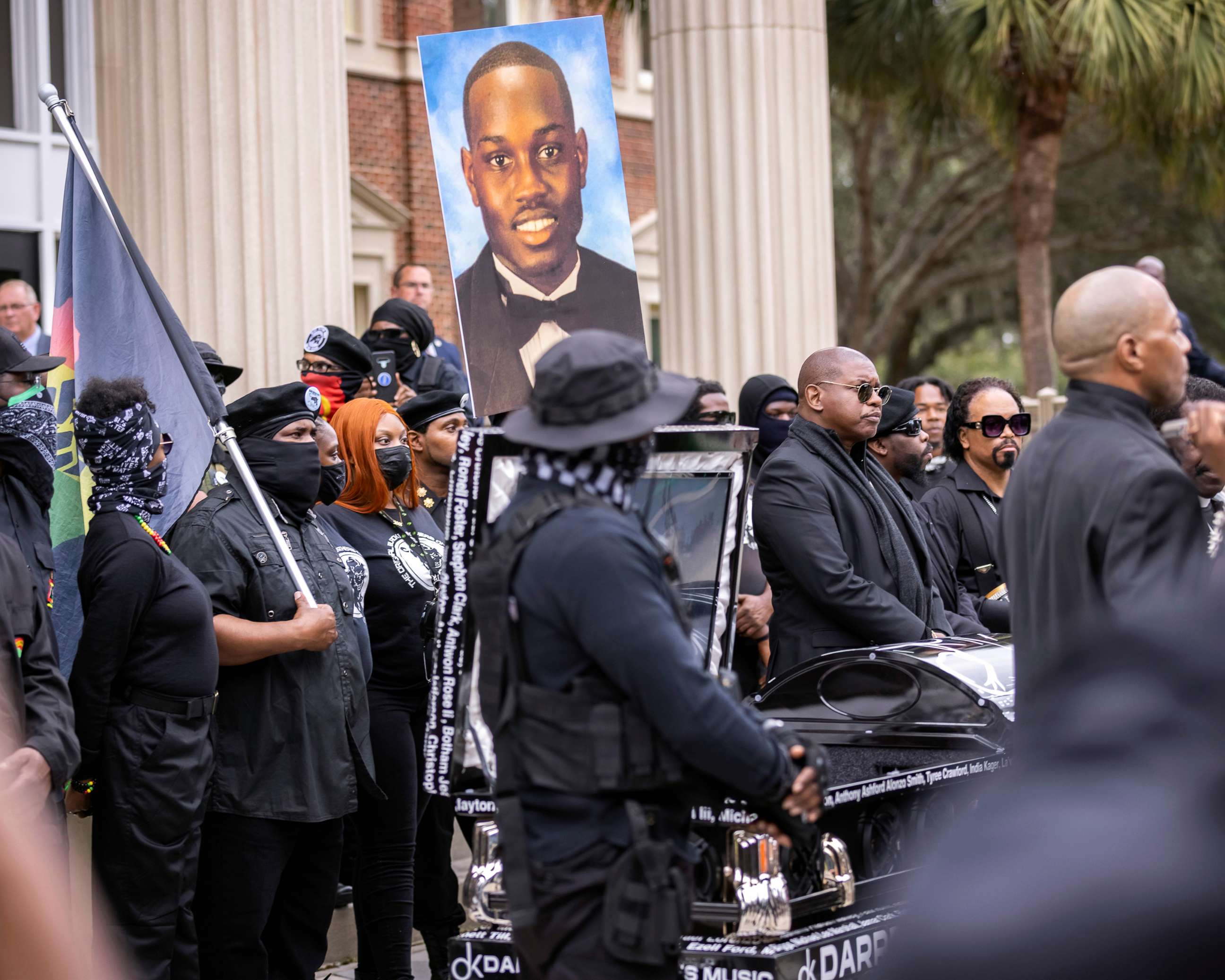 PHOTO: Dozens of Black Lives Matter and Black Panther gather outside the Glynn County Courthouse where the trial of Travis McMichael, his father, Gregory McMichael, and William "Roddie" Bryan is being held, Nov. 22, 2021, in Brunswick, Ga.