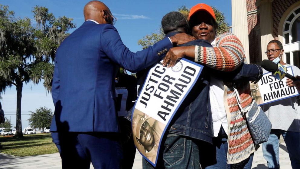 PHOTO: Ruby Arbery hugs Marcus Arbery during a protest in front of the Glynn County courthouse in Brunswick, Ga. on Oct. 20, 2021, demanding justice for Ahmaud Arbery who was killed by white men last year in the Satilla Shores subdivision.