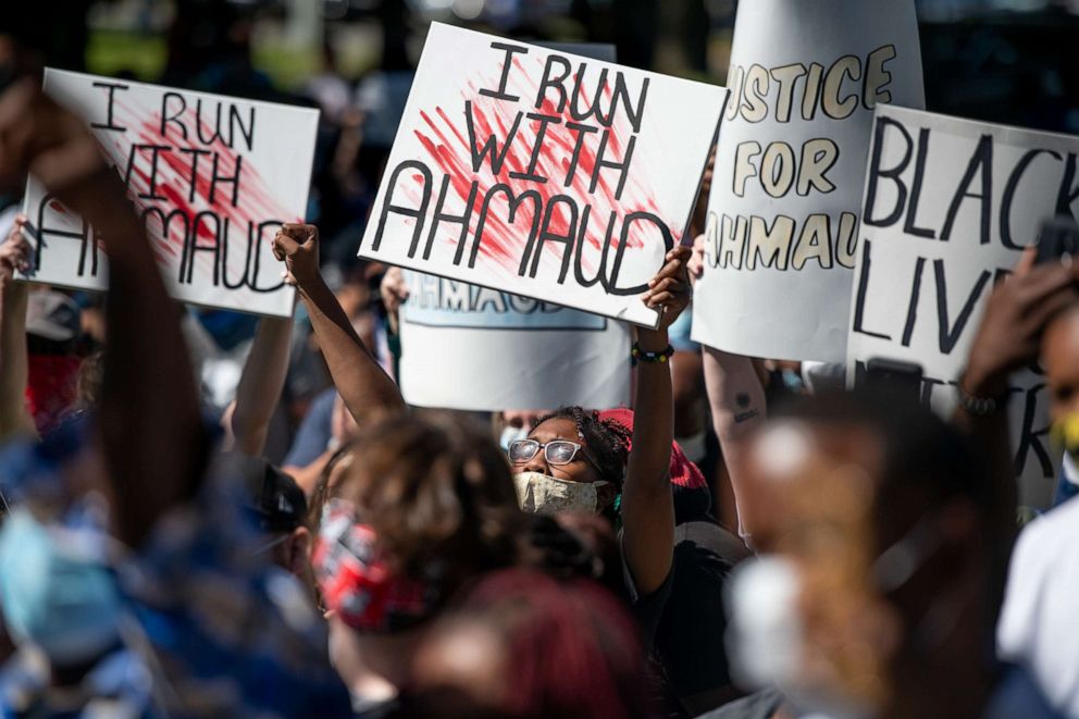 PHOTO: Demonstrators protest the shooting death of Ahmaud Arbery at the Glynn County Courthouse, May 8, 2020, in Brunswick, Ga. Gregory McMichael and Travis McMichael were arrested the previous night and charged with murder.