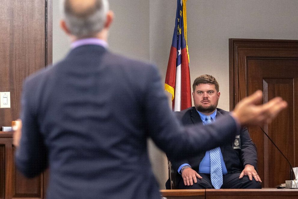 PHOTO: Travis McMichael's attorney Jason B. Sheffield, center, questions Glynn County police officer Parker Marcy during the trial of Greg McMichael and his son, Travis McMichael, and a neighbor, William "Roddie" Bryan Nov. 9, 2021, in Brunswick, Ga.