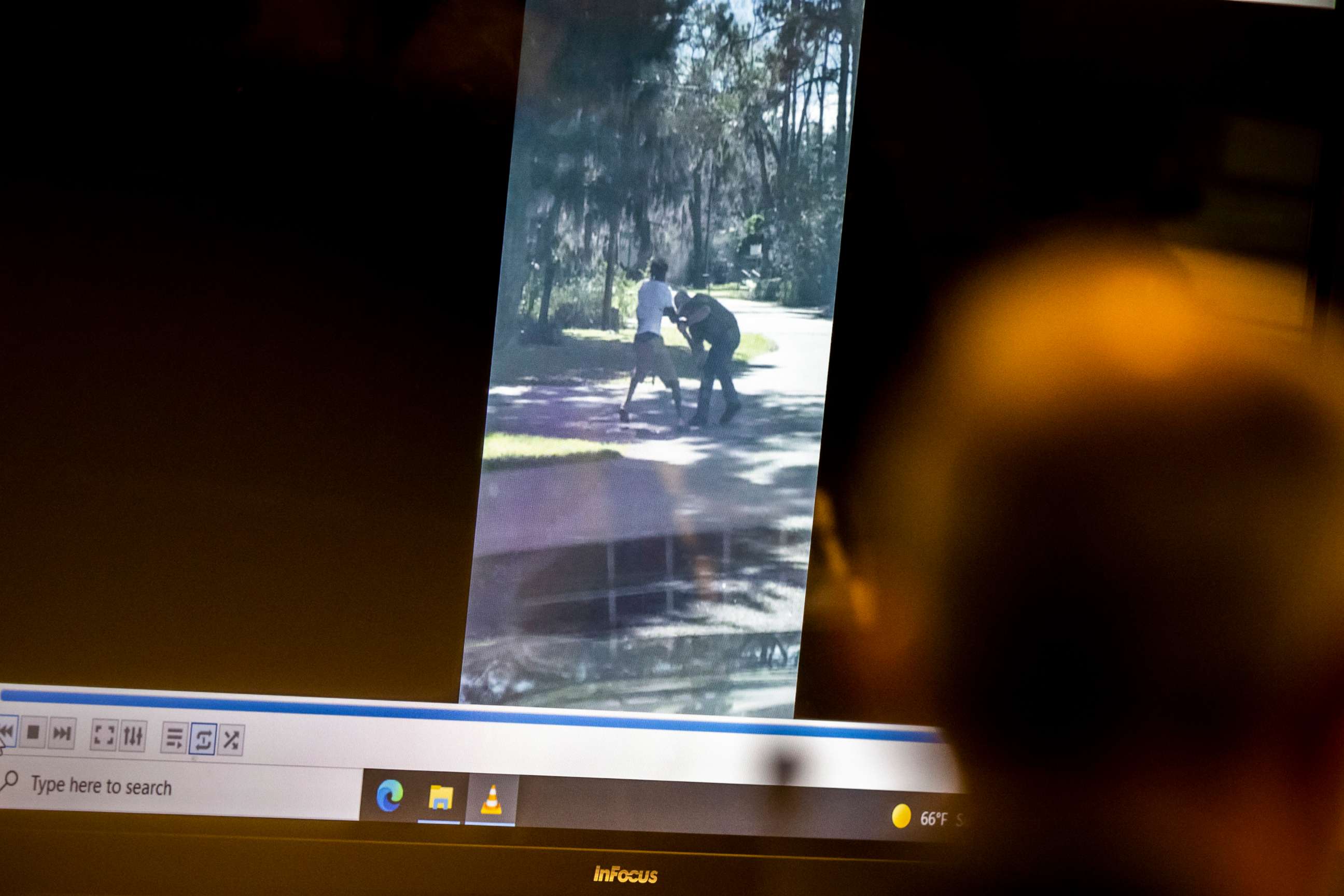 PHOTO: Prosecutor Linda Dunikoski shows an image from a video taken during the struggle between Ahmaud Arbery, left, and Travis McMichael, right, during the trial, Nov. 15, 2021, in Brunswick, Ga. 