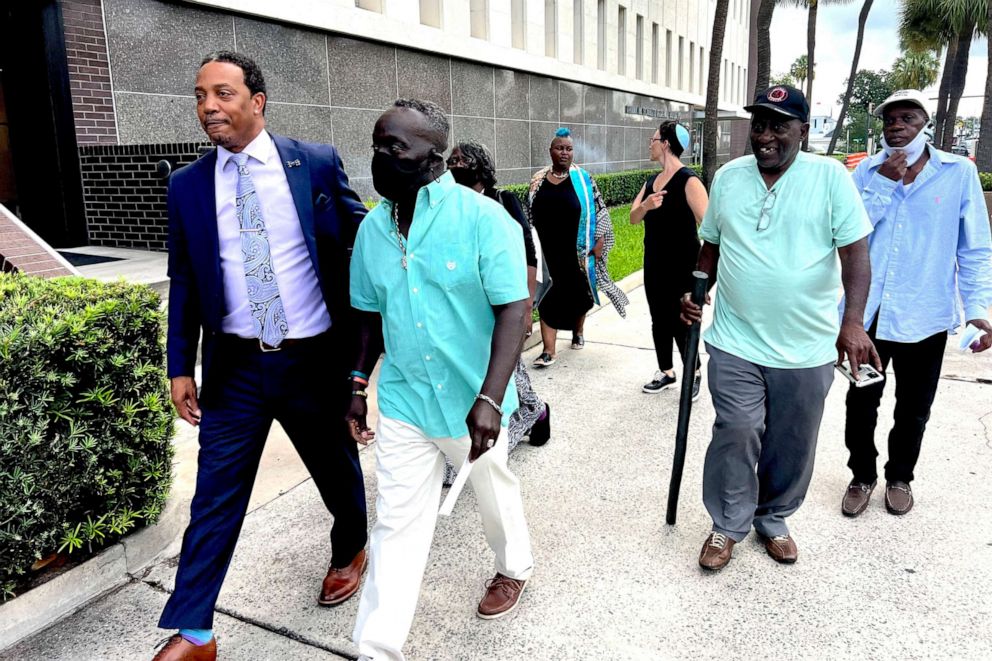 Photo: Marcus Arbery, second from left, Ahmed Arbery's father, arrives at Federal Court in Brunswick, Ga., on August 8, 2022, to hear the sentencing of 3 white men convicted of federal hate crimes in murder.  Arbery.
