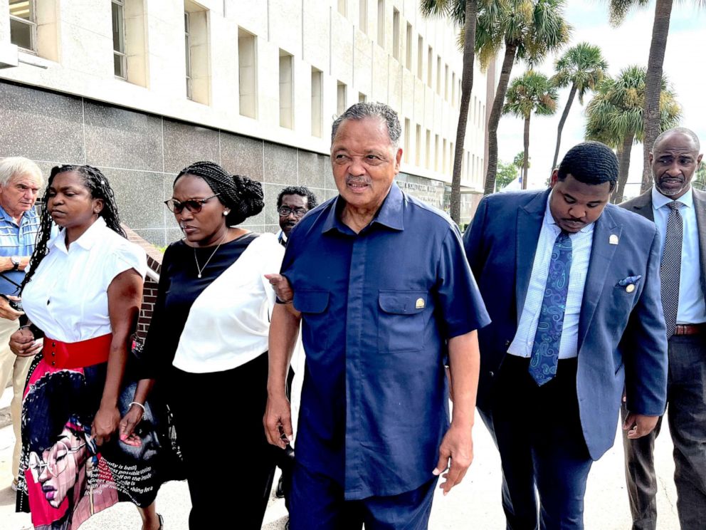 PHOTO: Rev. Jesse Jackson escorts Wanda Cooper Jones, second from left, Ahmaud Arbery's mother, into the courthouse, Aug. 8, 2022, in Brunswick, Ga., for the sentencing hearings of the 3 white men convicted of federal hate crimes in the killing of Arbery.