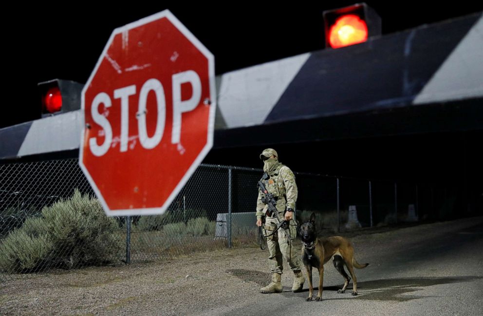 PHOTO: A security guard stands at an entrance to the Nevada Test and Training Range near Area 51 Friday, Sept. 20, 2019, near Rachel, Nev. People gathered at the gate inspired by the "Storm Area 51" internet hoax.