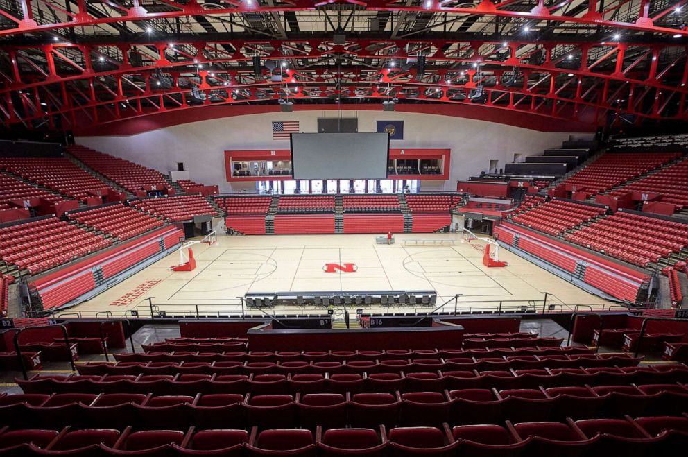 PHOTO: The Bob Devaney Sports Center is being prepared for the Nebraska boys basketball tournament, in Lincoln, Neb., March 11, 2020, which they were planning to play as scheduled but with only players' immediate families allowed into the venues as fans.