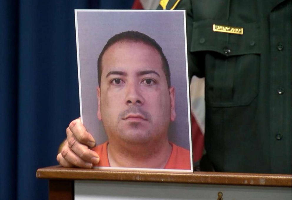 PHOTO: Polk County, Florida, Sheriff Grady Judd holds a photo of  Charles Aguon, the headmaster of a private Christian school, who is suspected of grooming and molesting a 15-year-old student, during a news conference on Feb. 6, 2019.