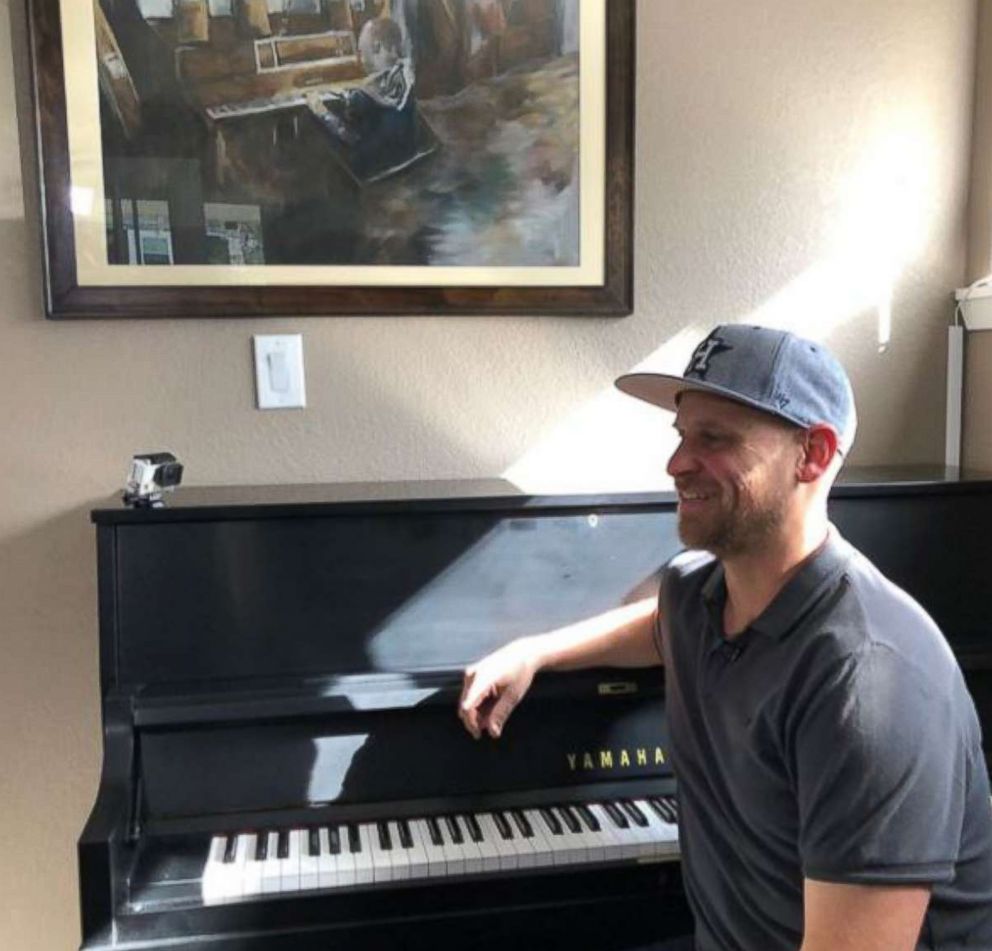 PHOTO: Aric Harding shows off his family's new piano. 