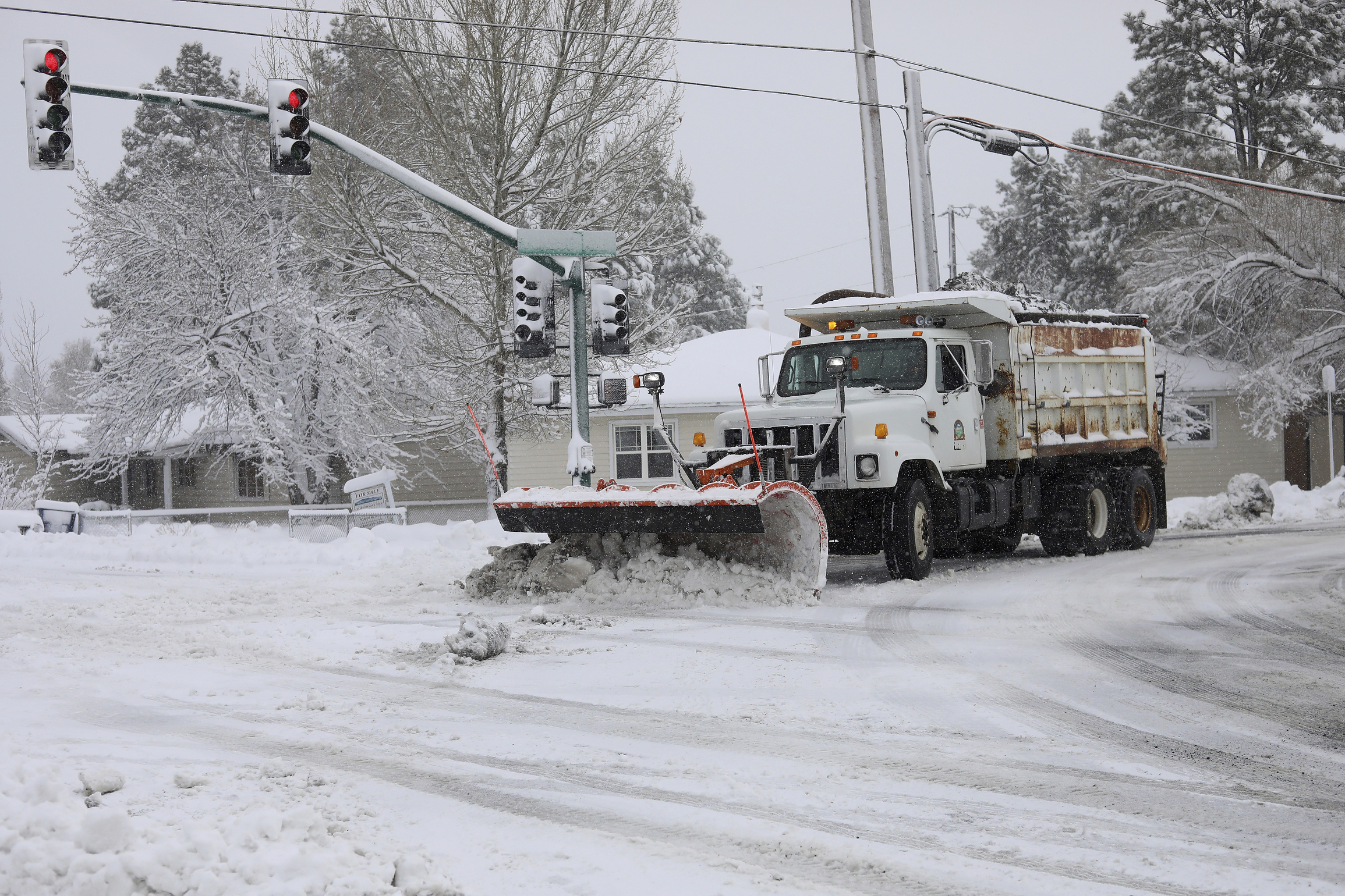 PHOTO: A city snowplow helps clear roads north of downtown Flagstaff, Ariz., Friday, Nov. 29, 2019.