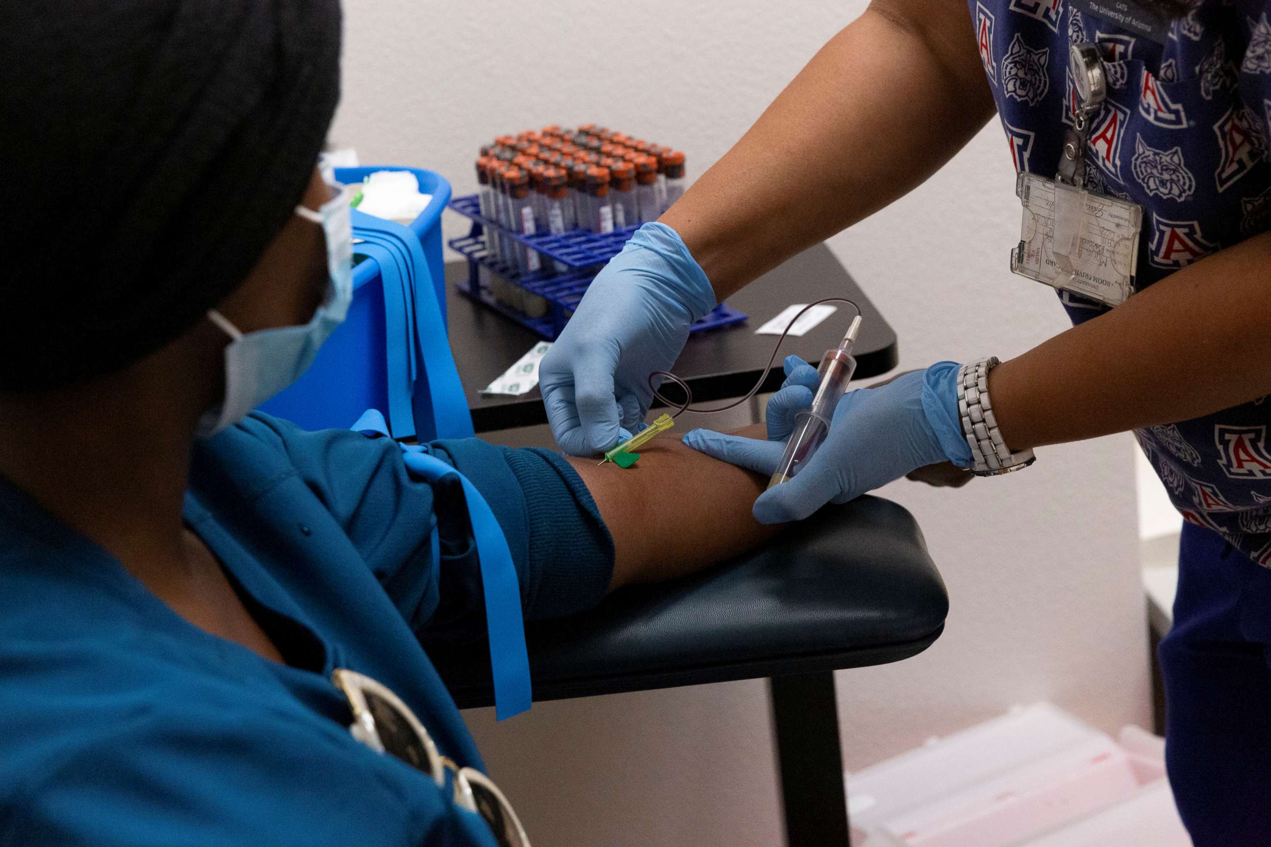 PHOTO: A heath care worker has her blood drawn for an antibody test for COVID-19 at the University of Arizona in Tucson, Arizona, July 10, 2020.