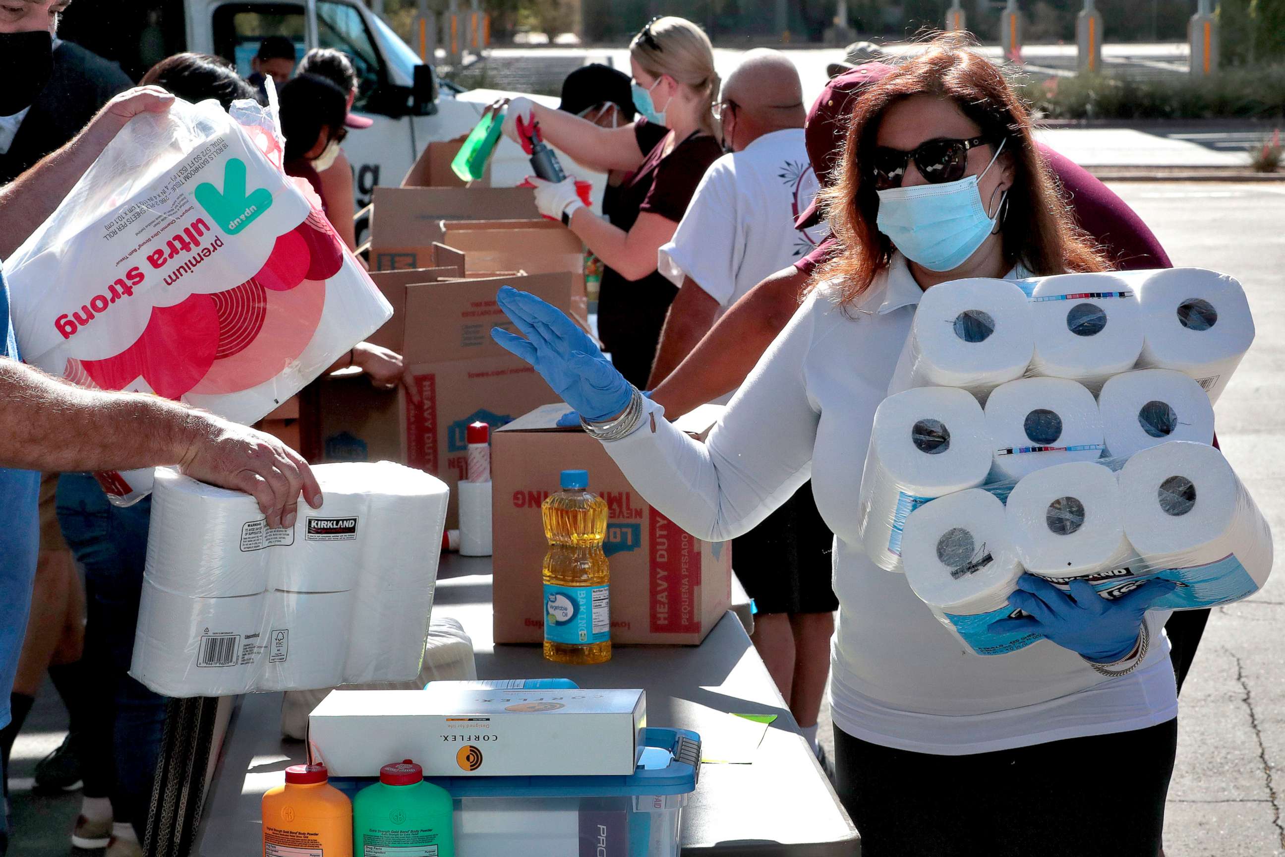 PHOTO: Volunteers prepare donations for delivery to those affected by COVID-19 on tribal lands, June 25, 2020, in Tempe, Ariz. 