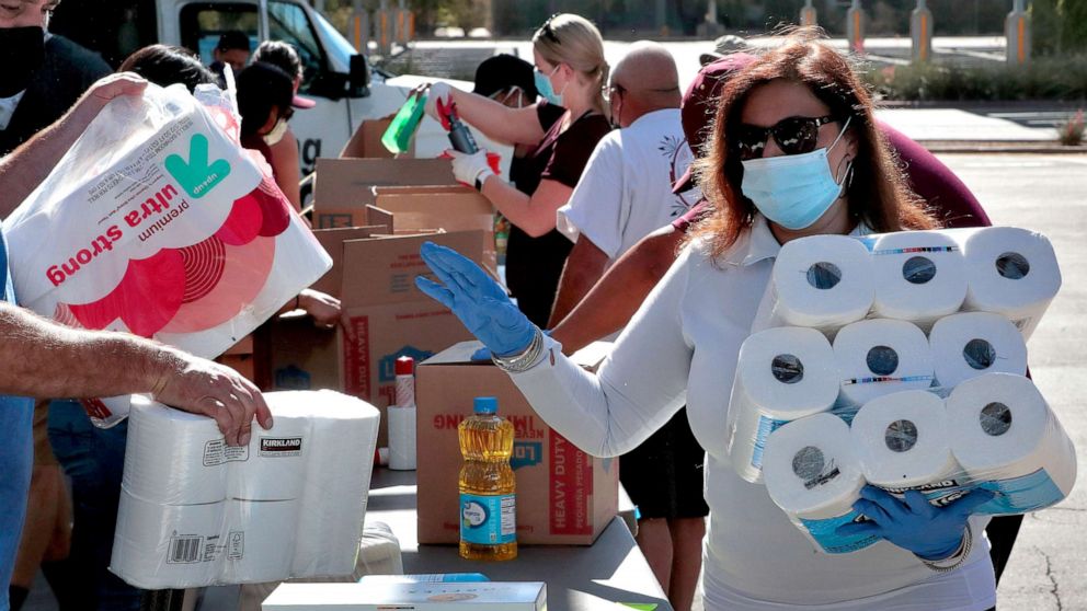 PHOTO: Volunteers prepare donations for delivery to those affected by COVID-19 on tribal lands, June 25, 2020, in Tempe, Ariz. 