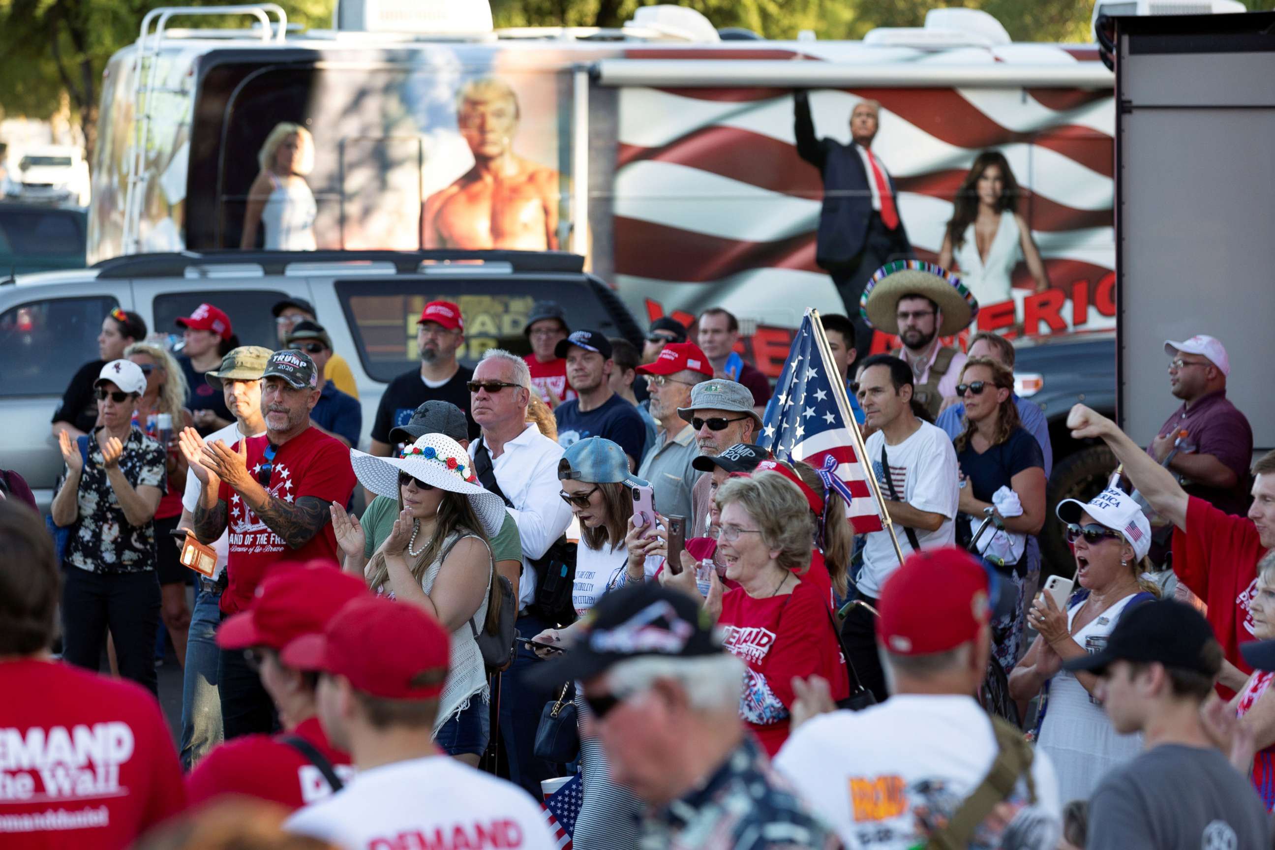 PHOTO: People listen to the speaker at a rally against restrictions to prevent the spread of coronavirus in Phoenix, July 4, 2020.