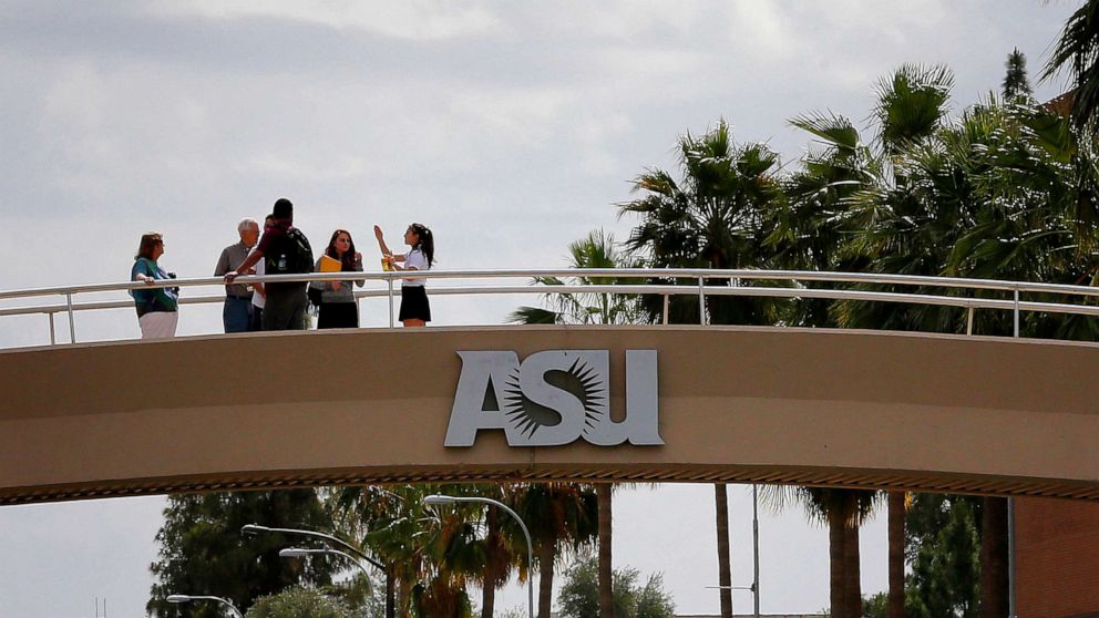 PHOTO: In this April 28, 2016, file photo, people stand on the campus overpass at Arizona State University in Tempe, Ariz.