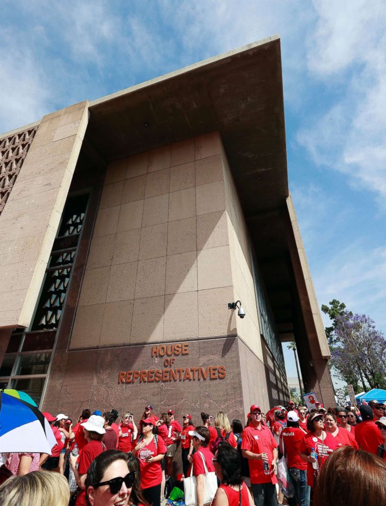 PHOTO: Teachers rally outside the Arizona House of Representatives Monday, April 30, 2018, in Phoenix on their third day of walk outs.