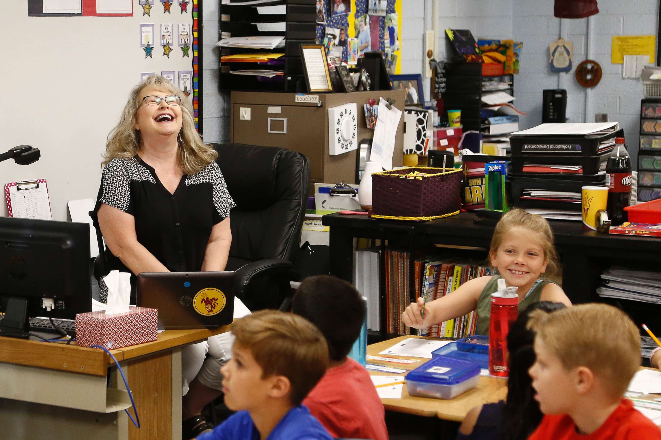 PHOTO: Cindy Cordts, a third grade teacher at Oakwood Elementary School, laughs along with some of her students as schools opened after a statewide teachers strike ended Friday, May 4, 2018, in Peoria, Ariz.