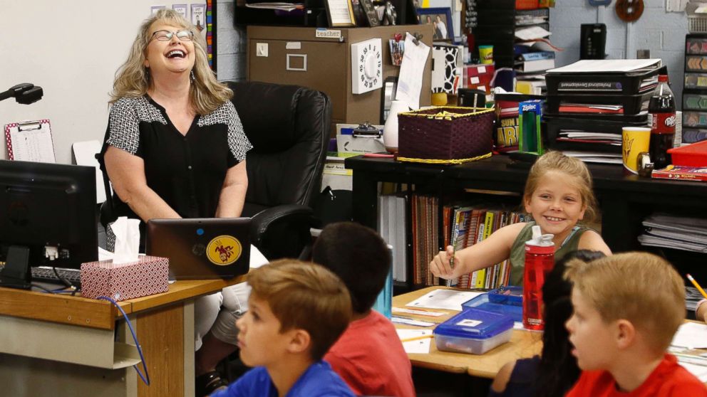 PHOTO: Cindy Cordts, a third grade teacher at Oakwood Elementary School, laughs along with some of her students as schools opened after a statewide teachers strike ended Friday, May 4, 2018, in Peoria, Ariz.