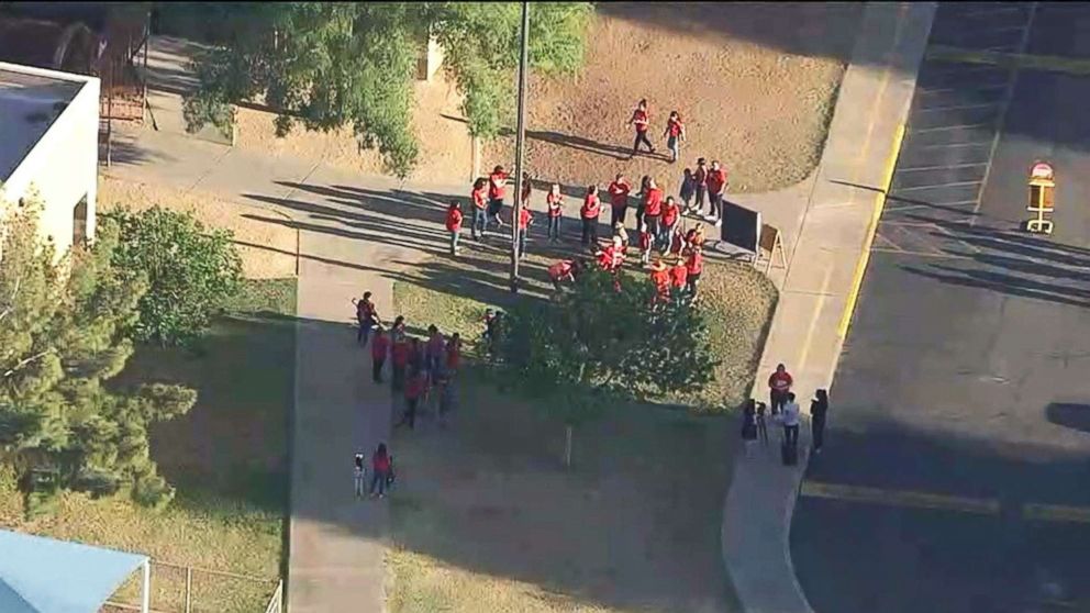 PHOTO: Teachers and supporters in the Phoenix area gathered outside schools to show support for increased teacher pay before the start of classes, April 4, 2018.