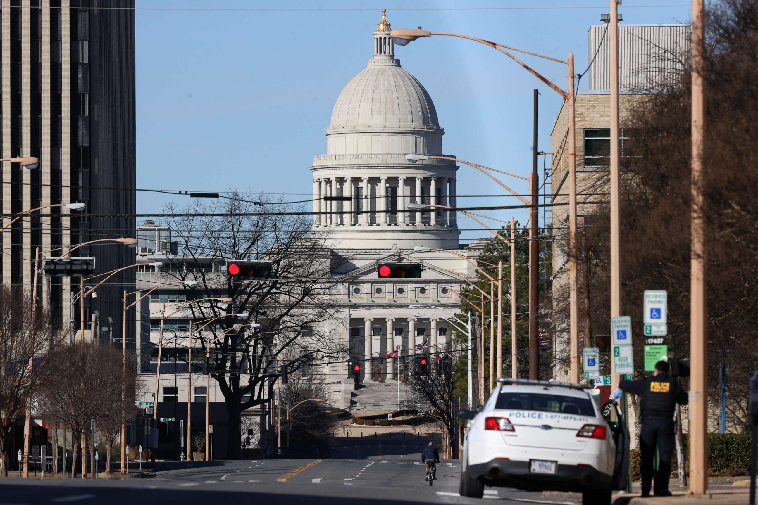 PHOTO: A police cruiser sits near the Arkansas State Capitol building in Little Rock, Ark., on Sunday, Jan. 17. 2021.