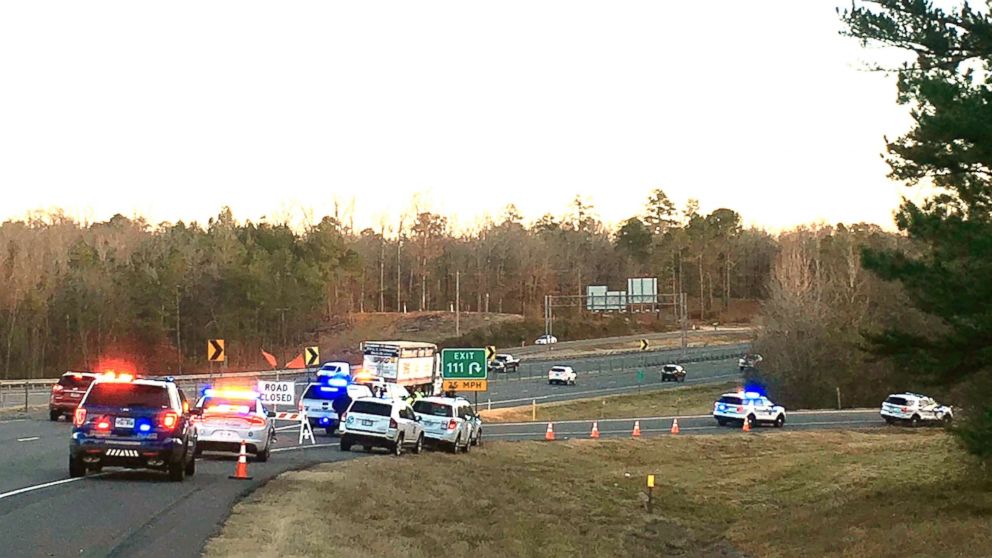 PHOTO: Emergency vehicles are parked along Interstate 30 near the scene where a charter bus that was carrying a youth football team from Tennessee crashed on Dec. 3, 2018, near Benton, Ark.