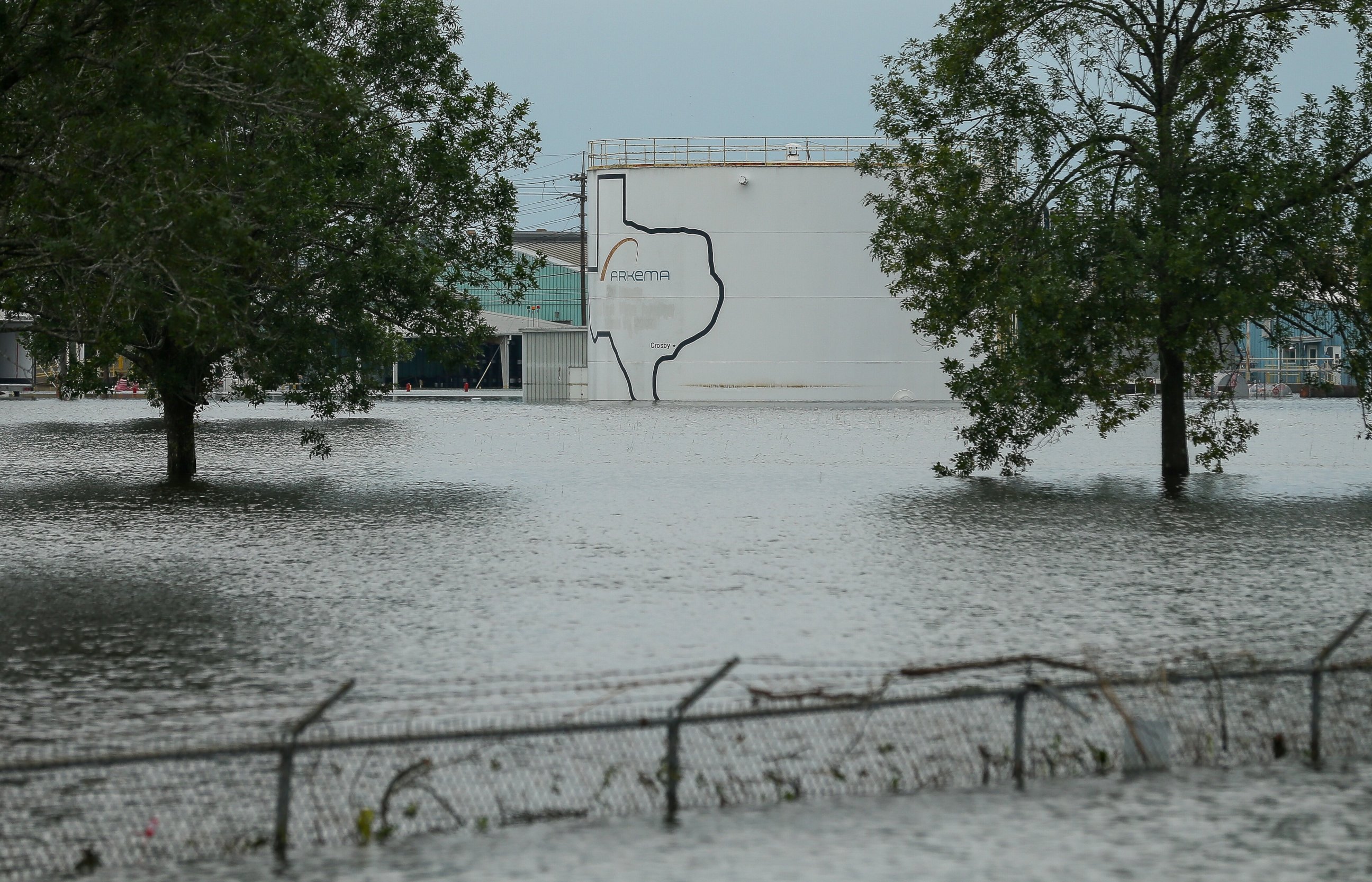 In this Aug. 30, 2017 photo, the Arkema chemical plant is flooded from Hurricane Harvey in Crosby, Texas. Nearby residents complain of a 'bitter taste' about the sparse information authorities provided when chemicals at the plant caught fire. 