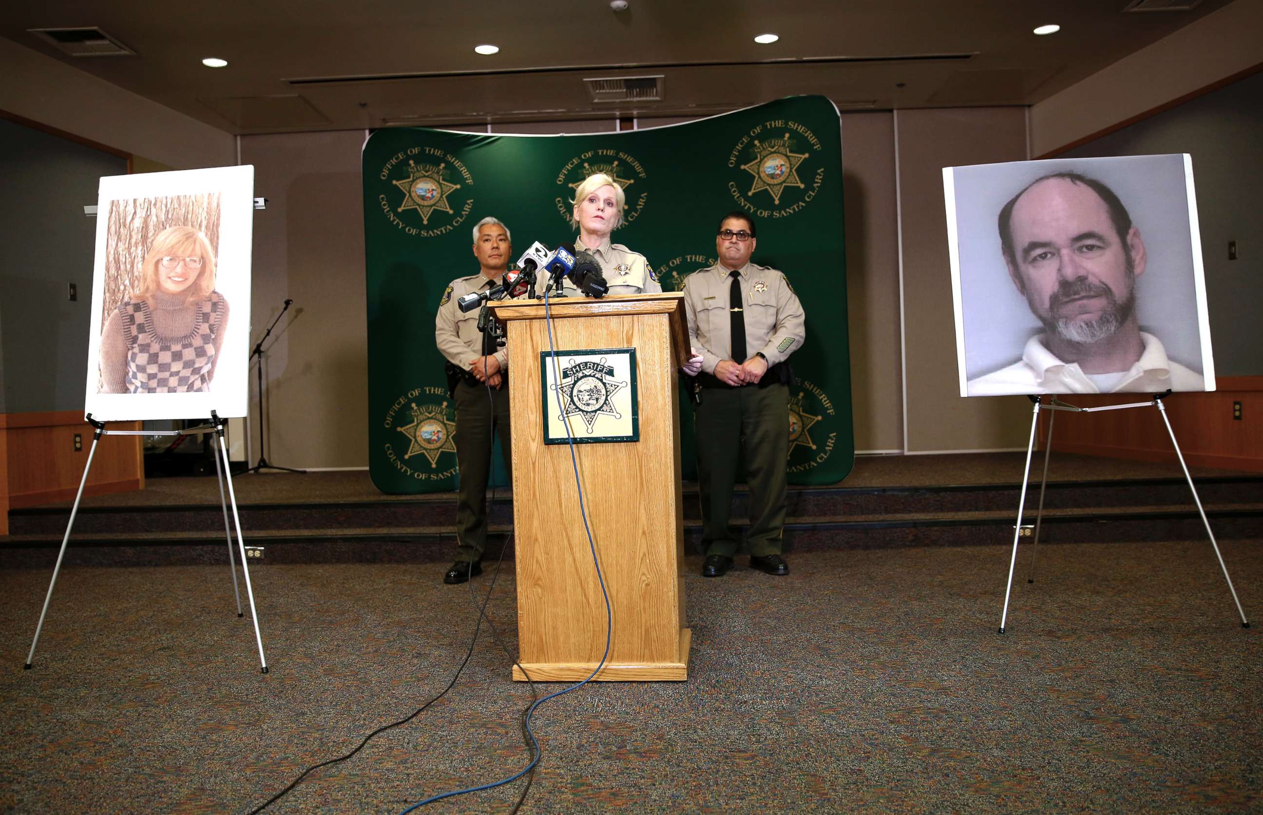 PHOTO: A photo of Stephen Blake Crawford stands as Santa Clara County Sheriff Laurie Smith speaks to the media about the 1974 killing of Arlis Perry at the Sheriff's office in San Jose, Calif., June 28, 2018.
