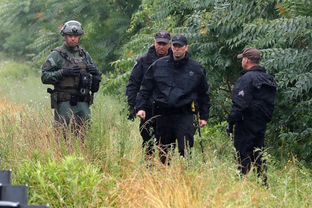 PHOTO: Police work on in the area of an hours long standoff with a group of armed men that partially shut down interstate 95, Saturday, July 3, 2021, in Wakefield, Mass.