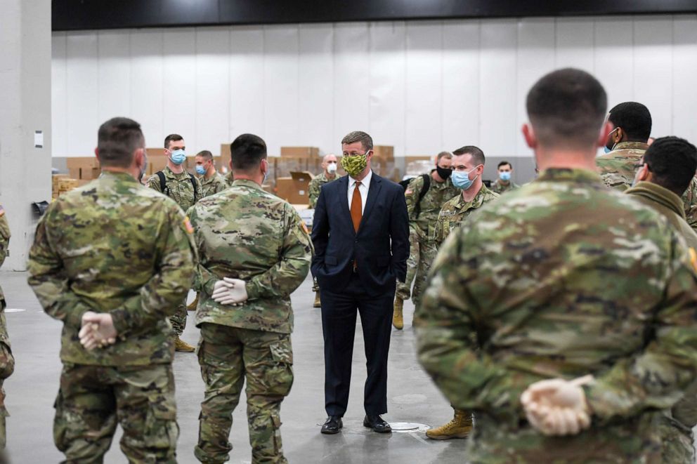 PHOTO: Secretary of the Army Ryan McCarthy, center, and Vice Chief of Staff of the Army Gen. Joseph M. Martin visit the TCF Center in Detroit, Mich., April 22, 2020.