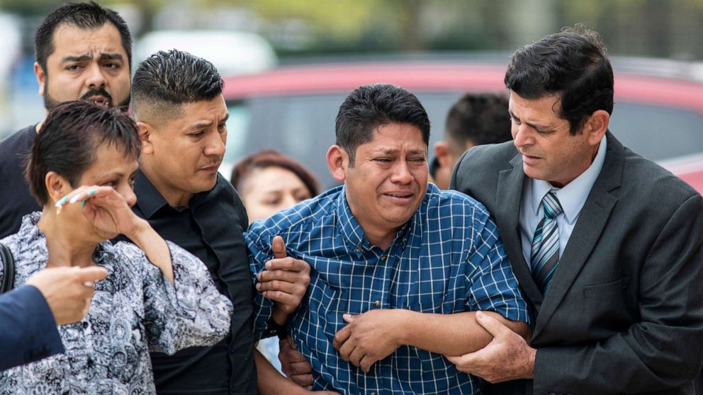 PHOTO: Arnulfo Ochoa, the father of Marlen Ochoa-Lopez, is surrounded by family members and supporters, as he walks into the Cook County medical examiner's office to identify his daughter's body, May 16, 2019, in Chicago.