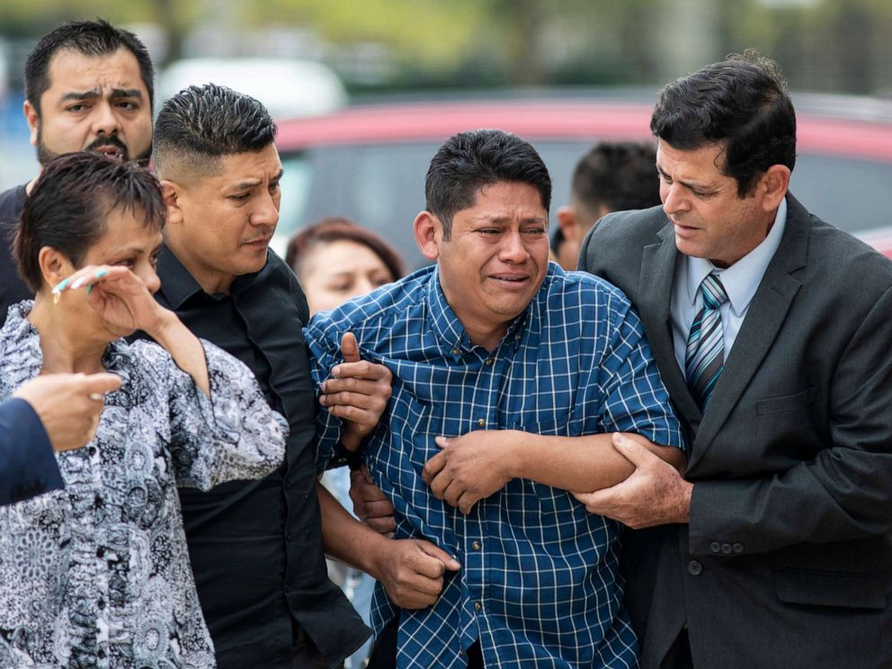 PHOTO: Arnulfo Ochoa, the father of Marlen Ochoa-Lopez, is surrounded by family members and supporters, as he walks into the Cook County medical examiner's office to identify his daughter's body, May 16, 2019, in Chicago.