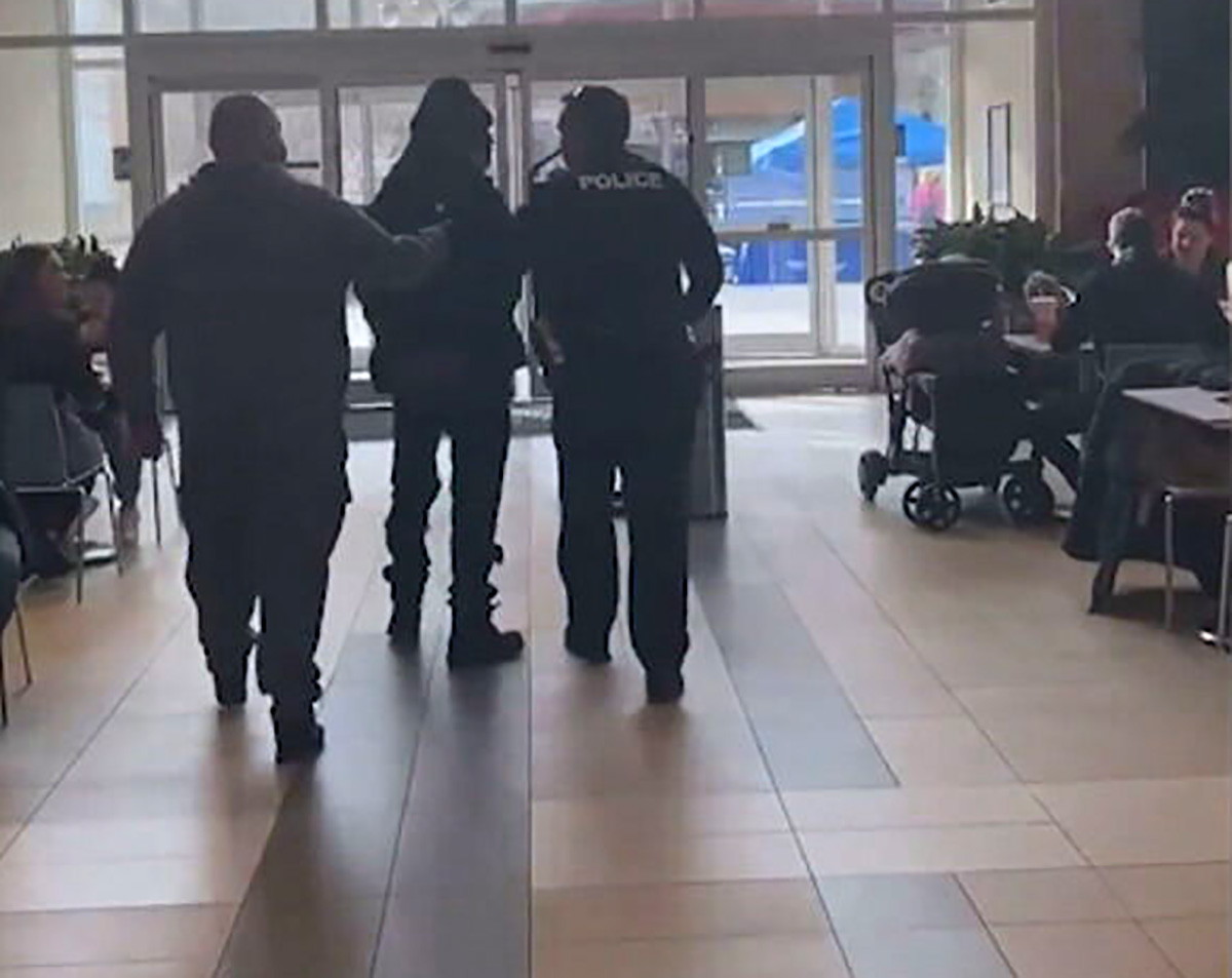 PHOTO: Jamar Mackey is put in handcuffs and escorted out of a shopping mall in Virginia Beach, Va., Dec. 19, 2020, after he was mistaken for a suspect in a credit card theft.