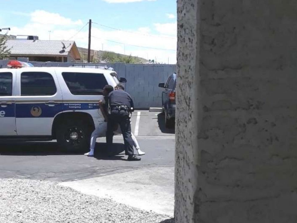 PHOTO: A video on a cell phone shows police officers from the Phoenix Police Department handcuffing Dravon Ames on May 27, 2019.