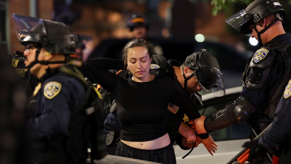 PHOTO: Members of law enforcement detain a person as protests against federal immigration sweeps continue, in downtown Los Angeles, California, U.S. June 9, 2025.