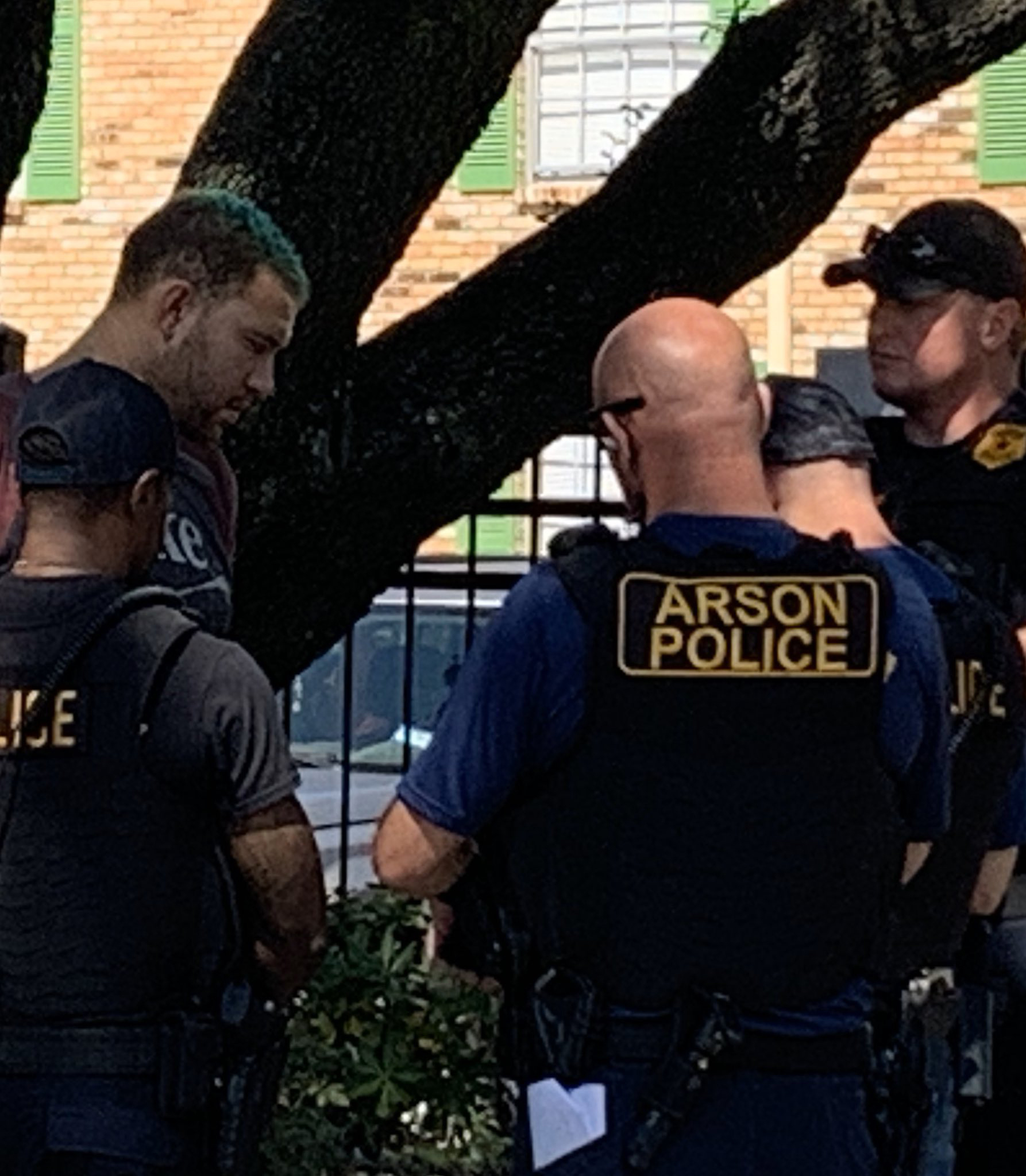 PHOTO: Joshua A. Rauch, 28, pictured here with green hair is arrested on Oct. 10, 2020, by police and arson investigators in Houston on suspicion of setting a series of fires that terrorized a neighborhood.