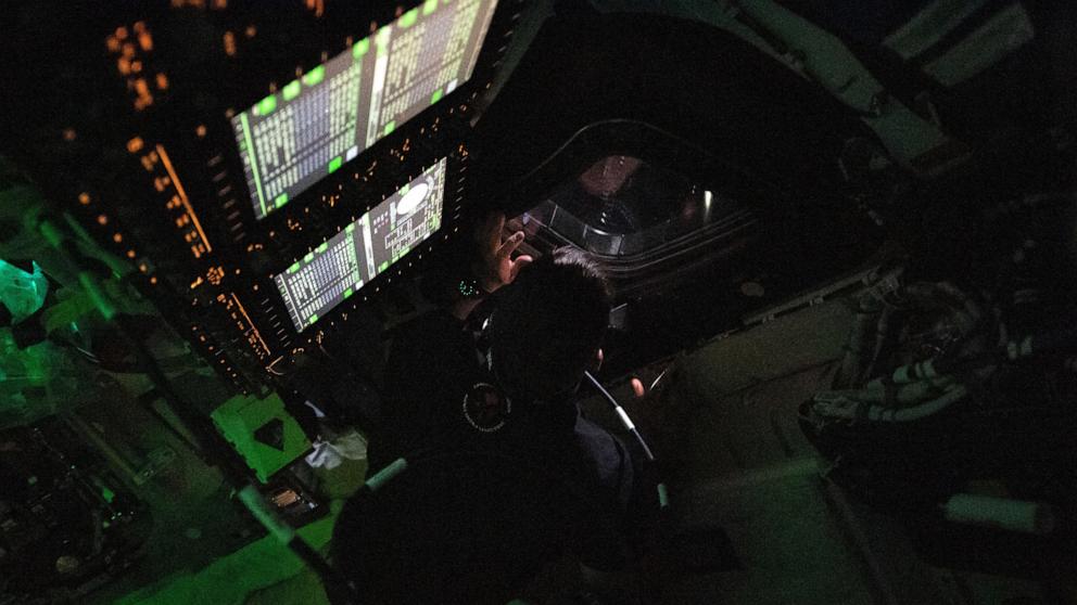 PHOTO: This handout picture by an Artemis II crew member provided by NASA shows Canadian Space Agency (CSA) astronaut Jeremy Hansen peering out the window of the Orion spacecraft on April 3, 2026. 