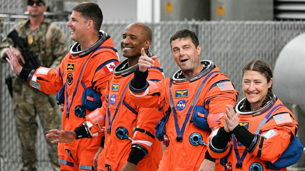PHOTO: CSA astronaut Jeremy Hansen with NASA astronauts Victor Glover, Reid Wiseman and Christina Koch walk out before traveling to the launch pad to board the Artemis II crewed lunar mission at Kennedy Space Center in Florida, April 1, 2026.