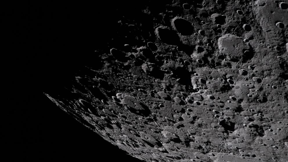 PHOTO: Captured by the Artemis II crew, April 6, 2026, the heavily cratered terrain of the eastern edge of the South Pole-Aitken basin is seen with the shadowed terminator, the boundary between lunar day and night at the top of the image. 