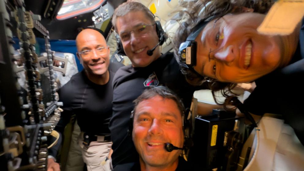 PHOTO: Midway through their lunar observation period, the Artemis II crew members, Reid Wiseman, Victor Glover, Christina Koch, and Jeremy Hansen pause to turn the camera around for a selfie inside the Orion spacecraft, April, 2026.